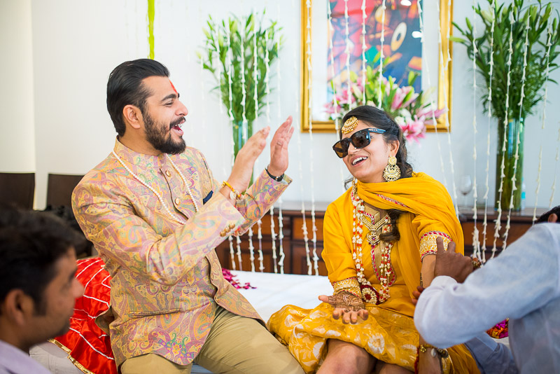 Wedding photographer capturing mehandi ceremony of indian bride