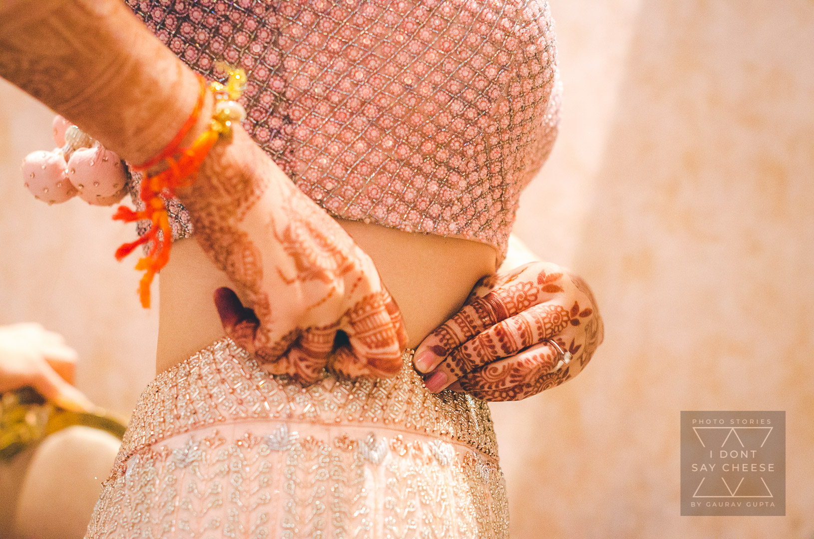 The bride adjusts her lehenga in her getting ready photos