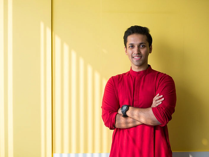 Durjoy Datta in red kurta against yellow background