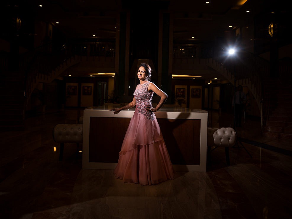 high contrast portrait of bride in pink evening dress
