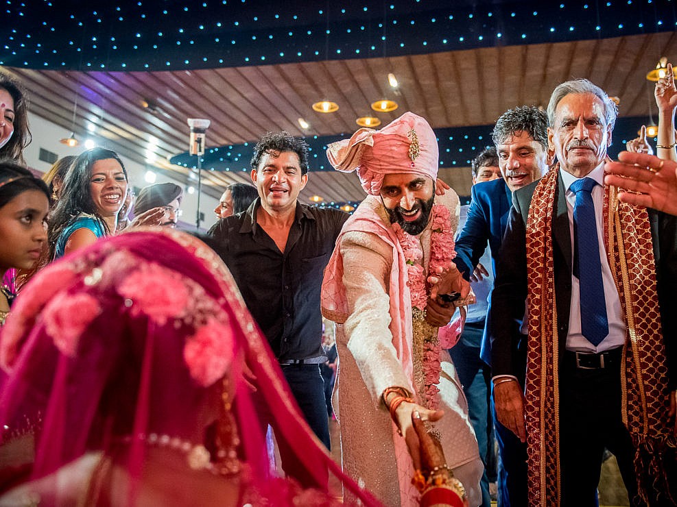 groom taking the bride's hand at indian wedding