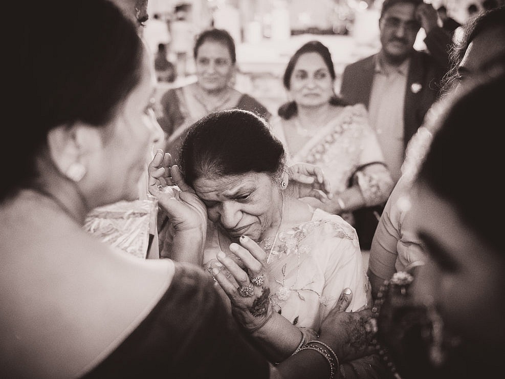grandmother crying at wedding of her grand daughter